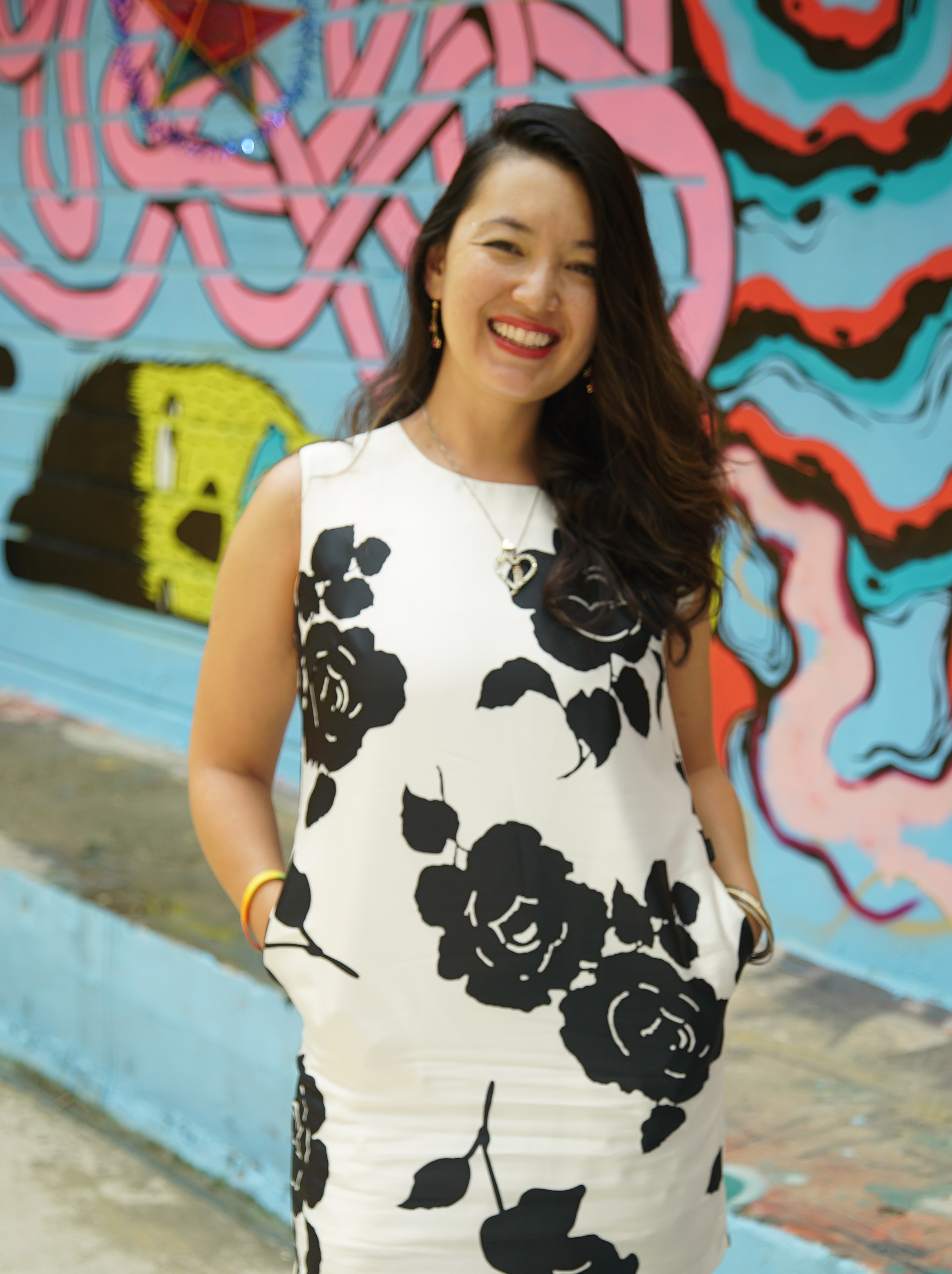 Nailed It logo: Neon Sign showing manicured hand with flower. 3